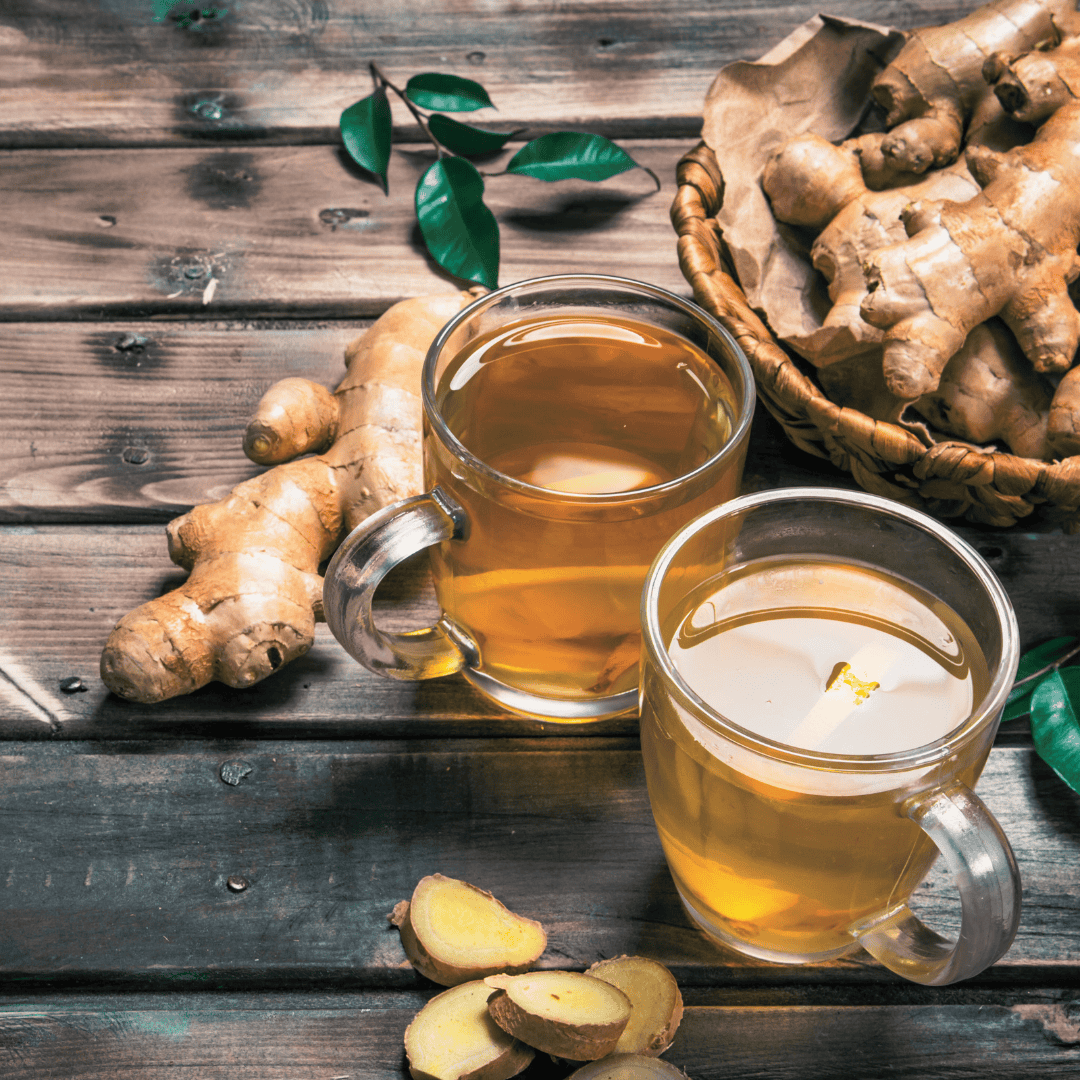 Herbal ginger tea in cozy glassware.