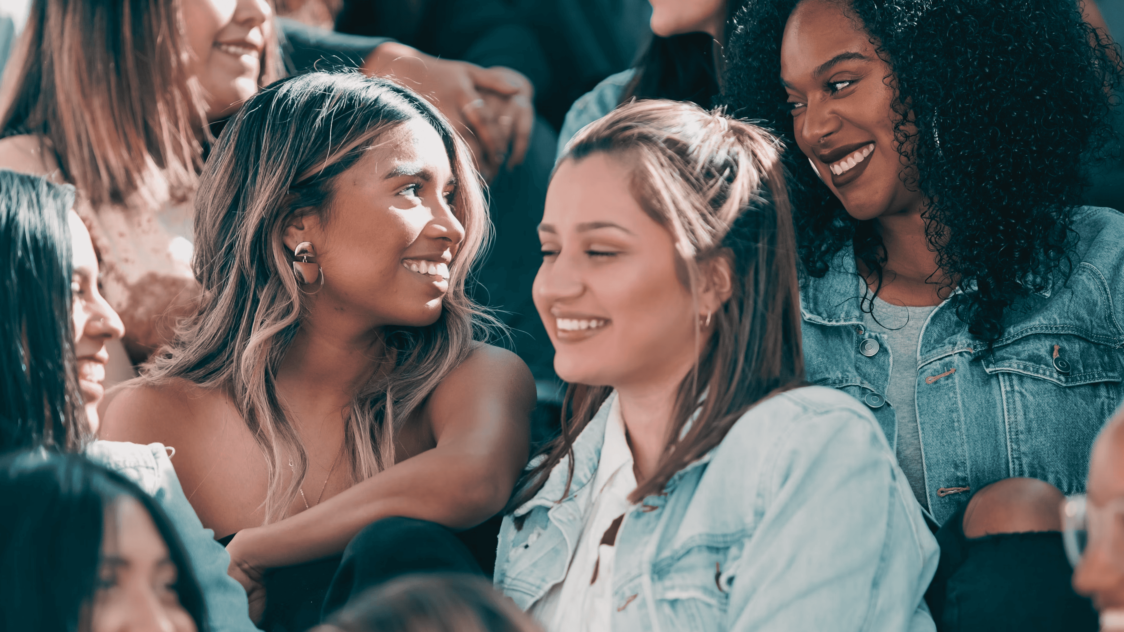 group of diverse young women supporting each other