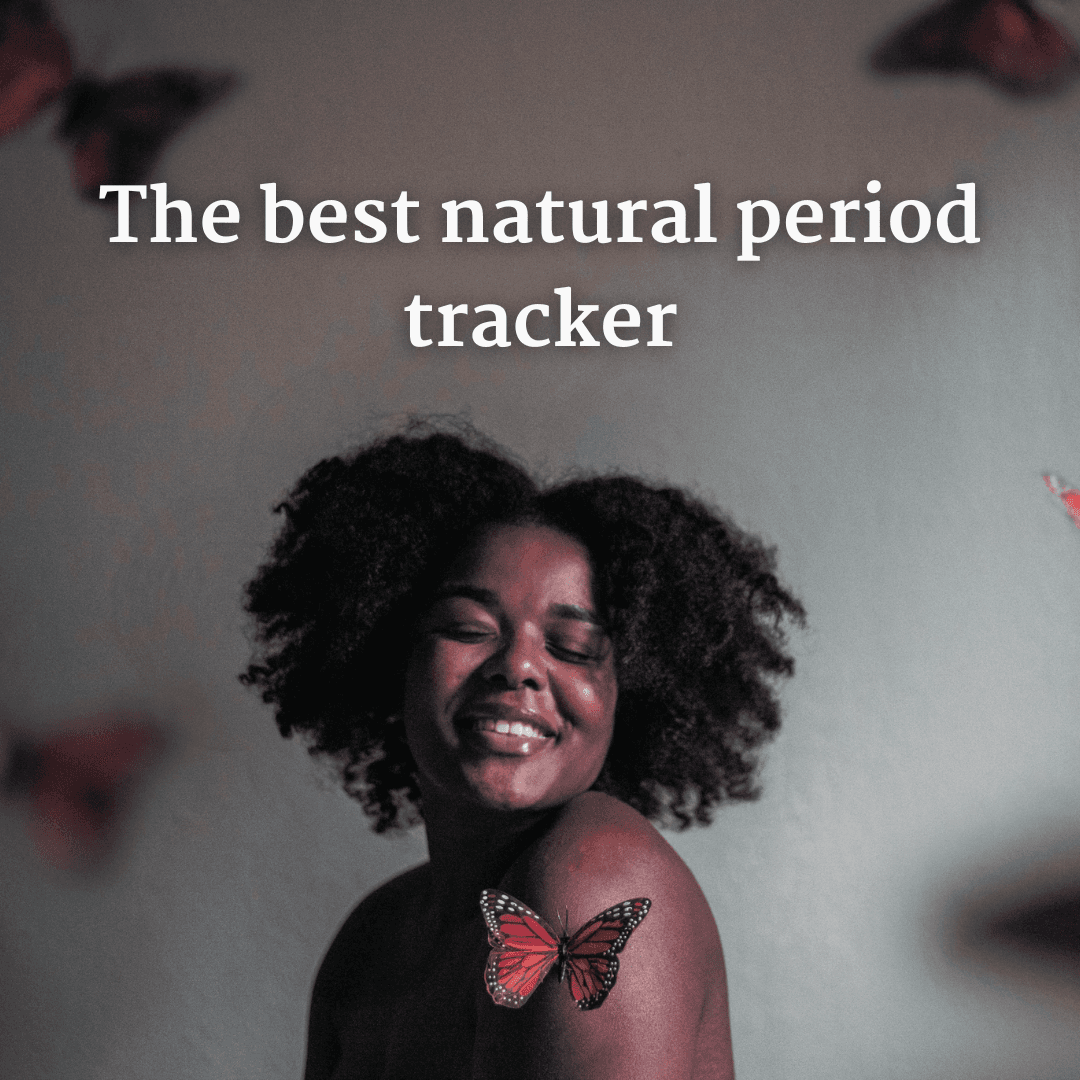 A smiling woman surrounded by butterflies
