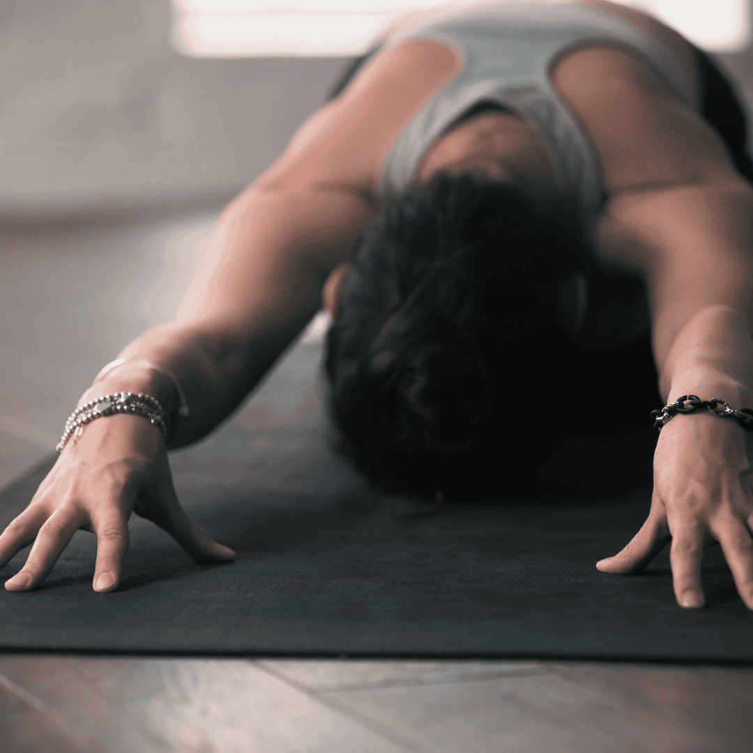 Woman doing child’s pose in yoga.