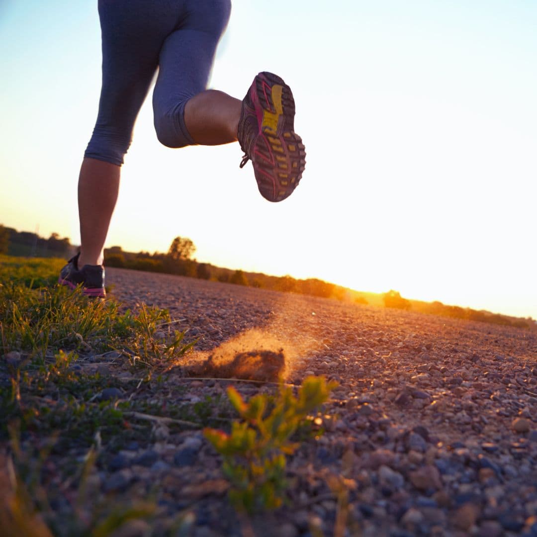 woman’s healthy habit of jogging into the sunset