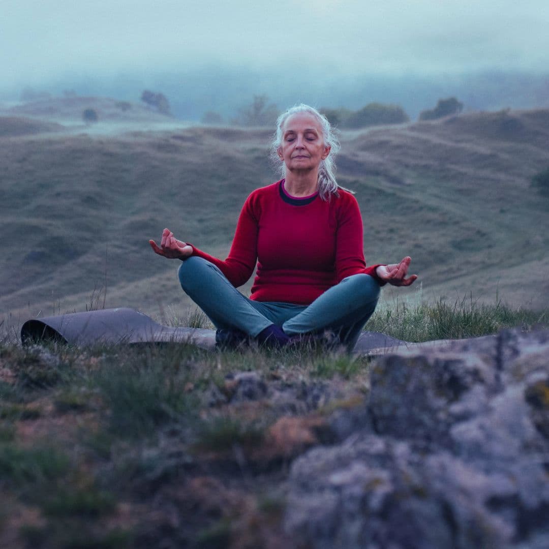 woman’s healthy habit of meditating in nature